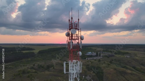 Telecommunication tower 5G Antenna at sunset. Connection system of communication systems in countryside.