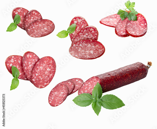 Smoked sausage slices and sausage stick with fresh herbs, isolated on a white background