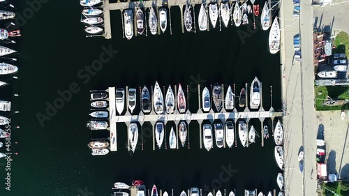 Yachts and sailboats moored in a marina, aerial top view. Hundreds of boats in port or pier in summer holidays. Monaco, France, Croatia, Italy, Fort Lauderdale, Gdynia, Greece.