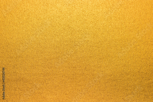 Soft gold background texture, subtle textured golden paper