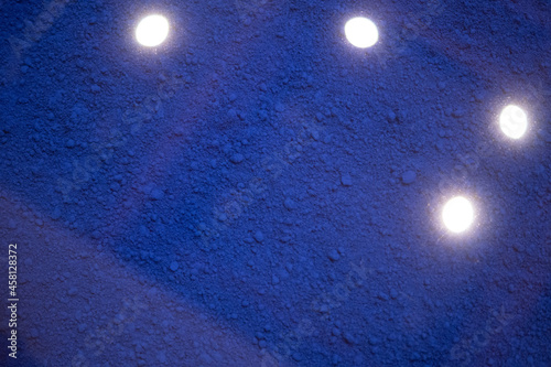 the texture of blue powder with the lamps turned on
