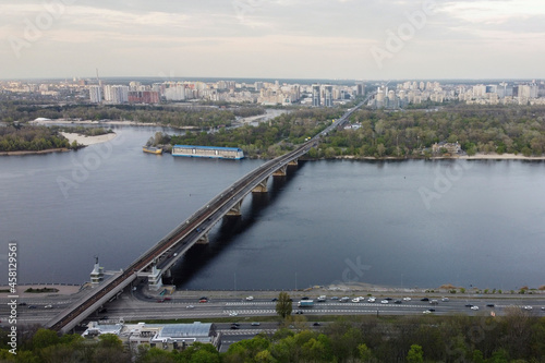 View of the road in the green city - Kiev. The photo shows the bridge