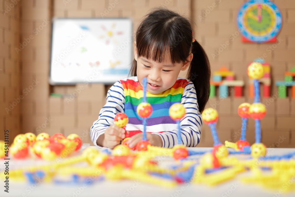 young irl playing creative toy blocks at home young irl playing creative toy blocks at home