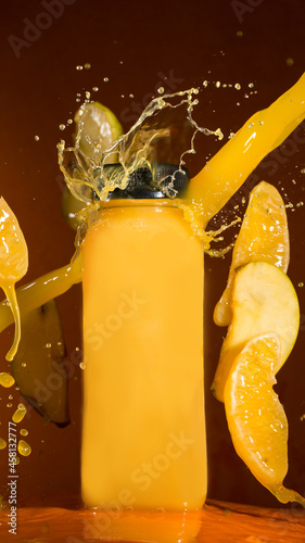 Product adv photography of an orange juice with splash effect.