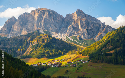Corvara in Badia charming small Italian mountain village in the valley in the background Sassongher beautiful mountain, Province of Bolzano, Val Gardena, South Tyrol