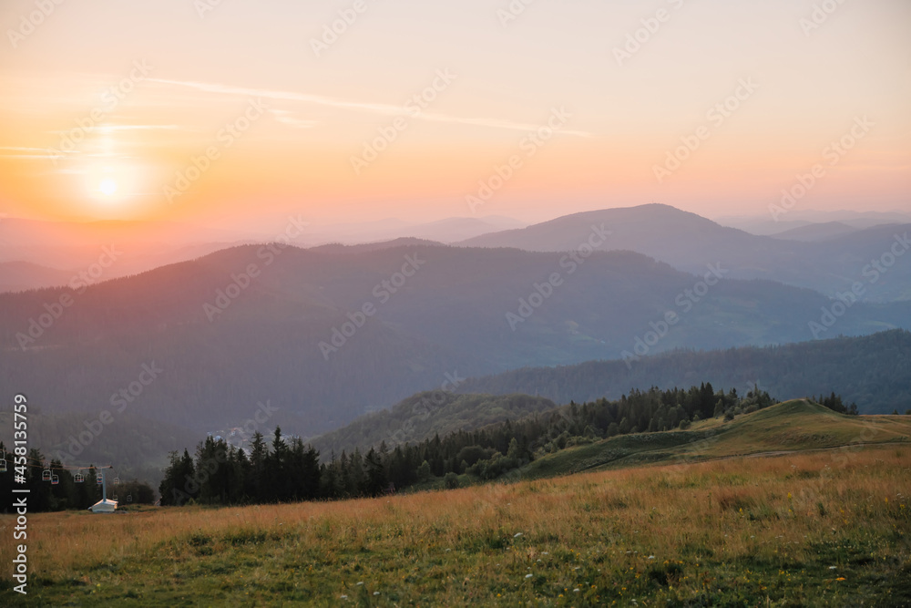 path to the mountains under the sun at sunset, beautiful landscape