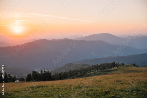 path to the mountains under the sun at sunset, beautiful landscape