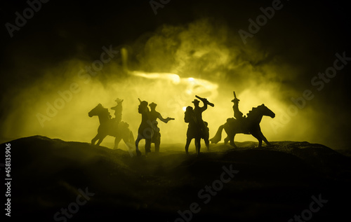 Western cowboy silhouette with texture at sunset and slivers of light