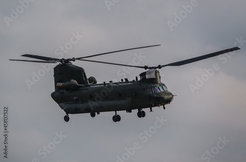 Wallpaper Mural RAF Chinook UH-1 helicopter flying low in a cloudy blue grey and white winter sky on a military exercise, Wiltshire UK Torontodigital.ca