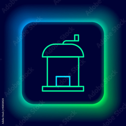 Glowing neon line Manual coffee grinder icon isolated on black background. Colorful outline concept. Vector
