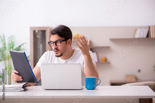Young male freelancer working from home