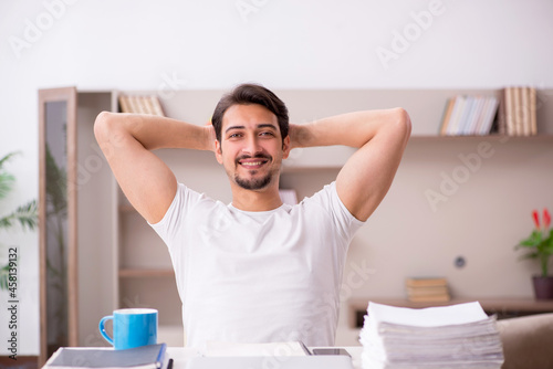 Young male freelancer working from home