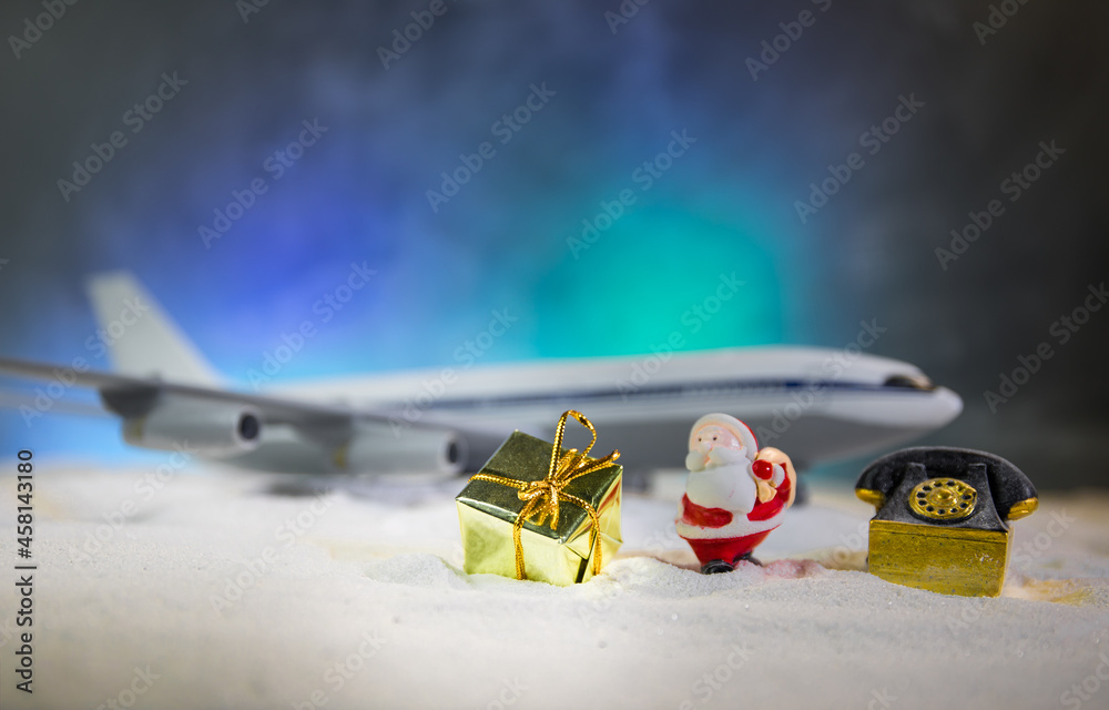 Obraz premium Merry Christmas and Happy new years travel concept background for winter trip on wood background , Travel with airplane top view with copy space.