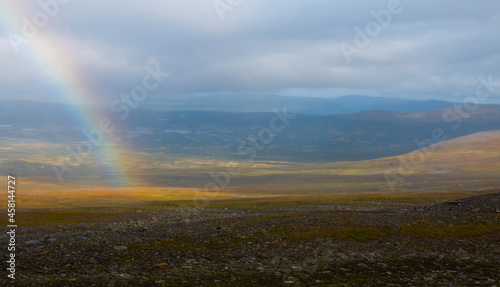 A rainbow around the Syter hut. A part of Kungsleden hiking trail between Hemavan and Ammarnas, Lapland, Sweden 