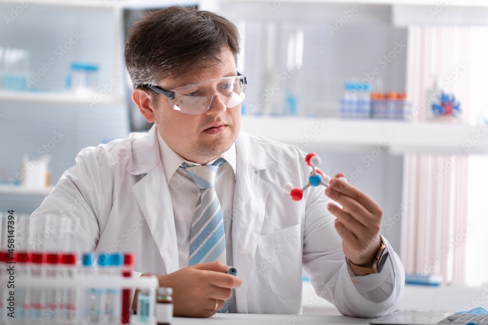 Modern Medical Research Laboratory, Scientists Working Together Analysing Chemicals