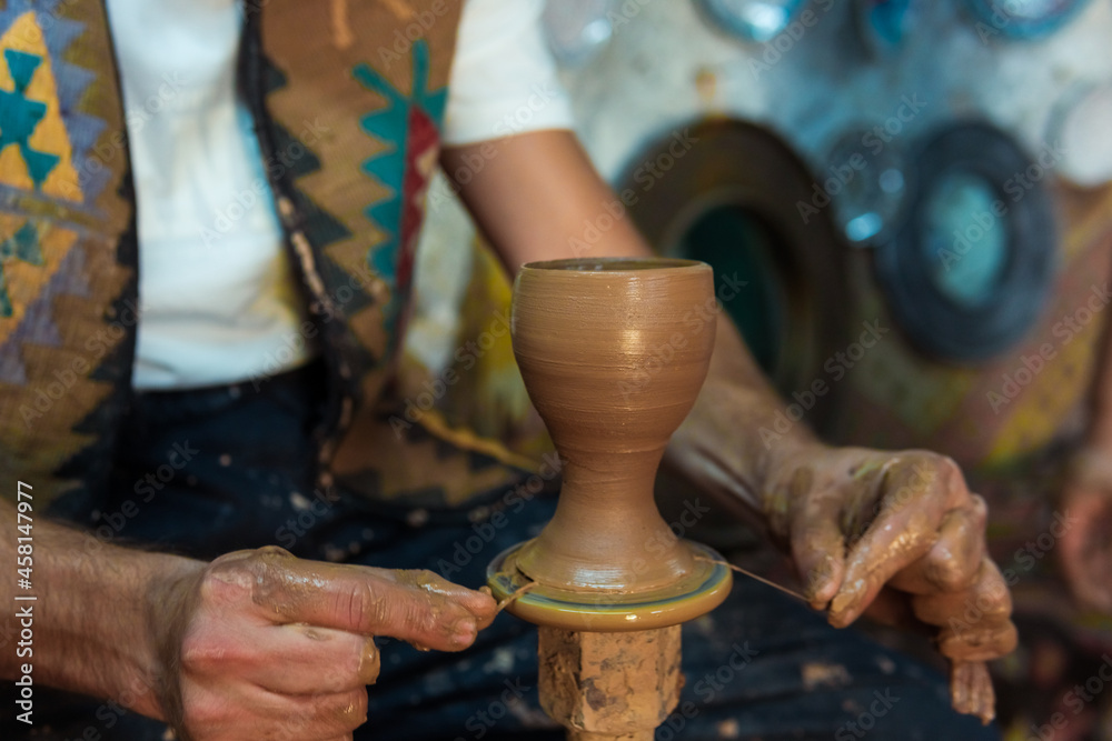 Pottery making, young man learning to make pottery , a man trying to