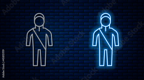 Glowing neon line Wetsuit for scuba diving icon isolated on brick wall background. Diving underwater equipment. Vector