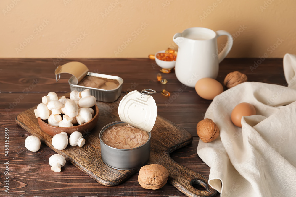 Obraz na płótnie Different healthy products with vitamin D on wooden background w salonie