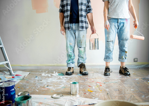 Couple painting the inside of their home