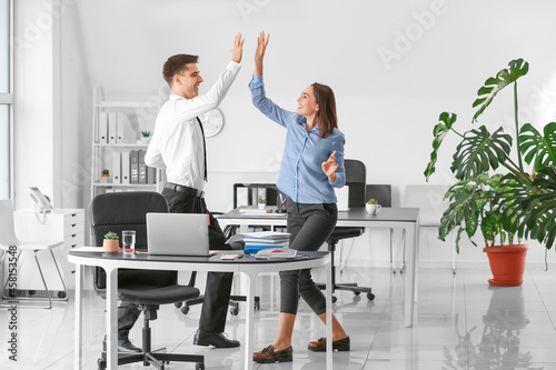 Young man giving high-five ...