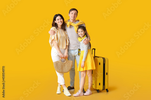 Happy family with luggage o...