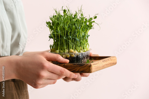 Woman with fresh micro gree...