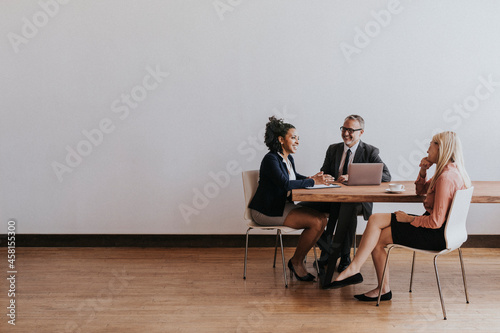 Business people discussing in a meeting room photo