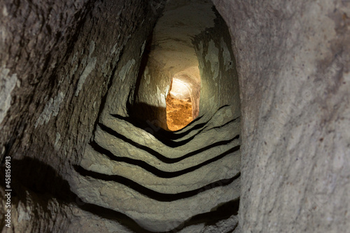 Underground city, stairs located in an underground city from ancient civilizations. photo