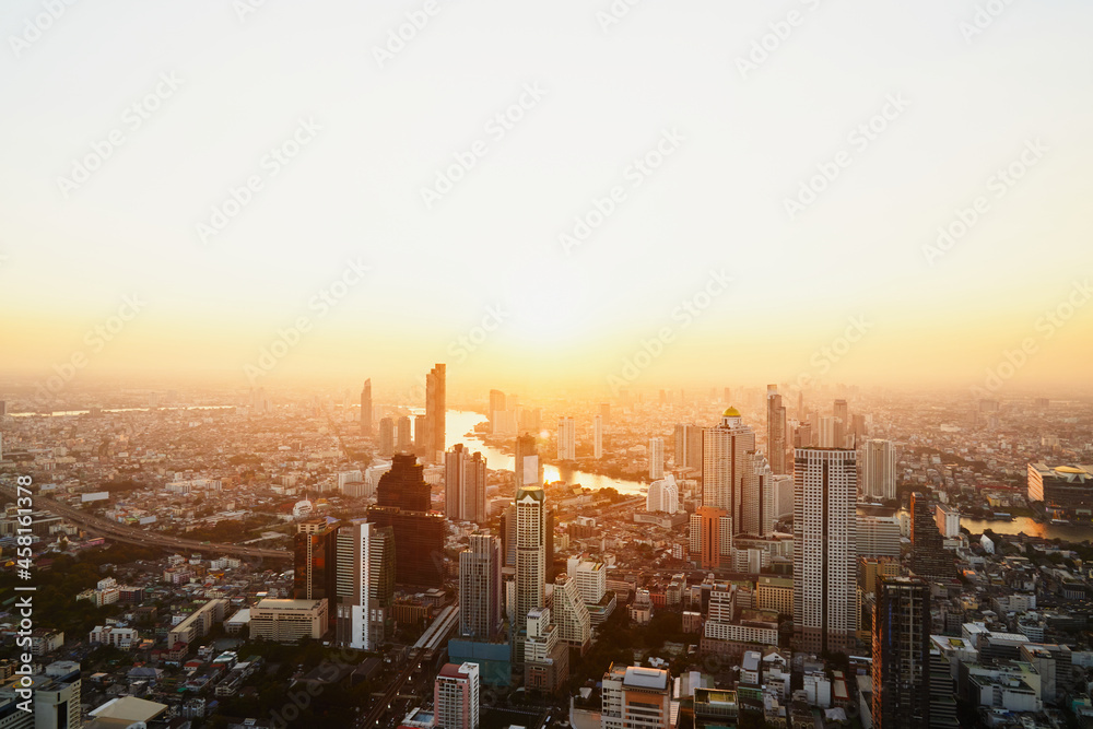 Landscape of the city of Bangkok painted by golden light during sunset
