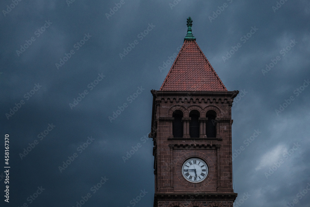 A Small New England Town Clock Tower with an Ominous Stormy Sky