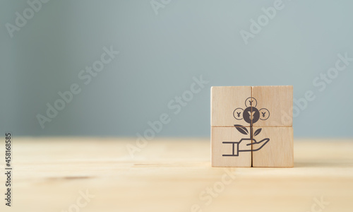 Yuan digital currency e-CNY concept. Technology digital financial and china cryptocurrency concept. Increase wealth to trader. Money growth icon on wooden cubes with beautiful background, banner.