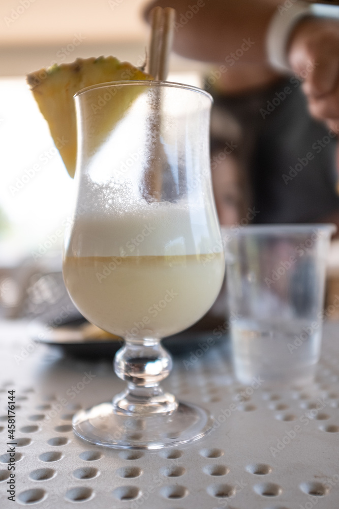 White fresh cocktail served on a wineglass pot on a restaurant table close up still White fresh cocktail served on a wineglass pot on a restaurant table close up still