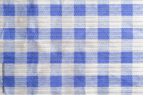 blue checkered material background, macro. Textile