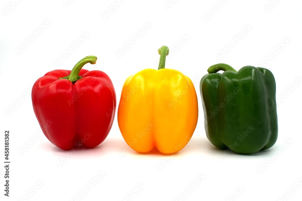 Red green and yellow bell peppers on white background Red green and yellow bell peppers on white background