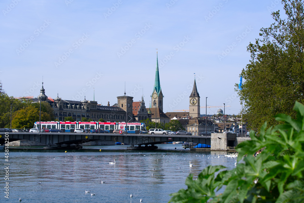 Lake Zurich with Quay Bridge and the old town of Zurich in the background on a sunny summer day. Photo taken September 7th, 2021, Zurich, Switzerland. Lake Zurich with Quay Bridge and the old town of Zurich in the background on a sunny summer day. Photo taken September 7th, 2021, Zurich, Switzerland.