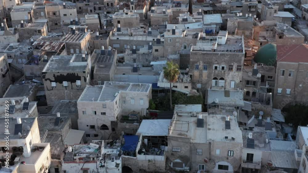 Acre old city port houses and Mosque at sunrise, Aerial view. Acre old city port houses and Mosque at sunrise, Aerial view.