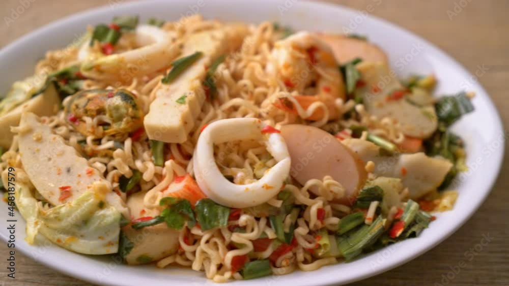 Instant noodle spicy salad with mixed meats - Asian food style Instant noodle spicy salad with mixed meats - Asian food style