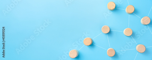Networking, social media, internet communication concept with Wooden cubes on blue background, copy space