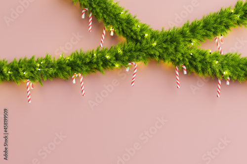 Christmas garlands with candies hung on a red background . 3d rendering