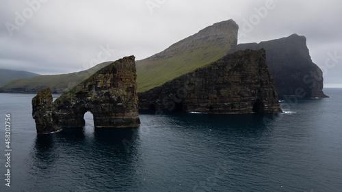 Beautiful aerial view of Drangarnir, the sea stacks between the islet Tindholmur in the Faroe Islands