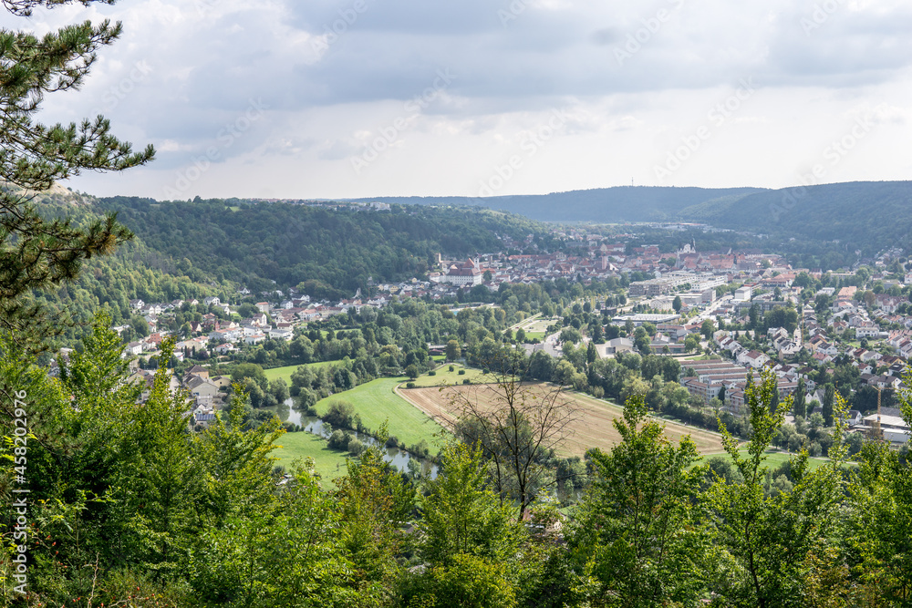 panoramic view over little city in a valley surrounded by hills in germany