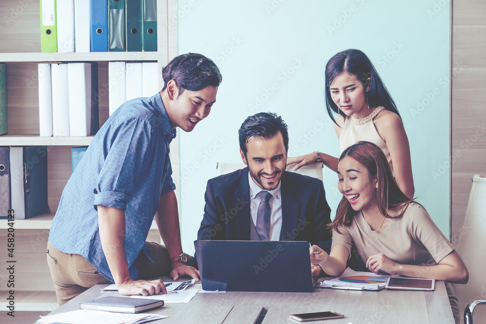 Manager and his team having meeting at meeting room in office. Manager and his team having meeting at meeting room in office.