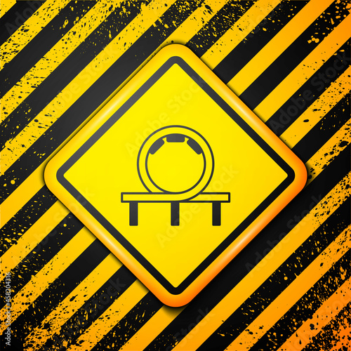 Black Roller coaster icon isolated on yellow background. Amusement park. Childrens entertainment playground, recreation park. Warning sign. Vector