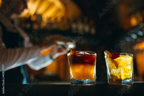 The bartender prepares cocktails at the bar.