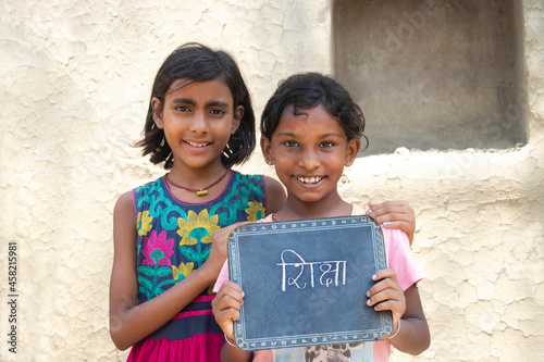 Photography Two Indian rural  girls holding slate
