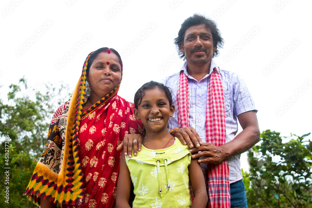 3 indian Rural farmer Parents and daughter standing - obrazy, fototapety, plakaty 