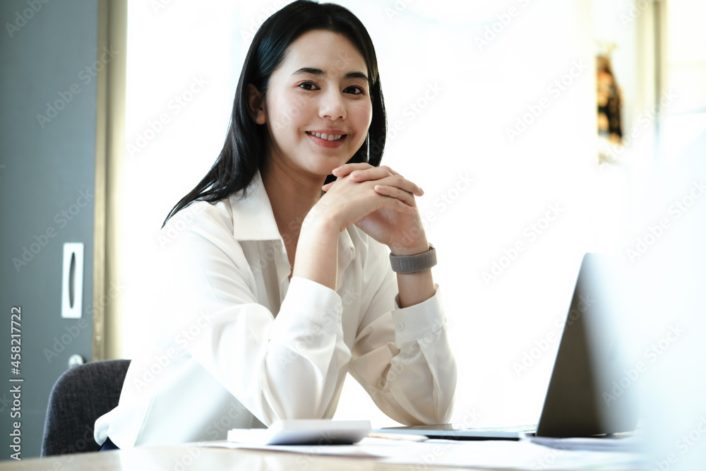 Female employees are working at home through computers to maintain social distancing to reduce the spread of coronavirus. Female employees are working at home through computers to maintain social distancing to reduce the spread of coronavirus.