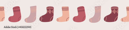 Seamless border with knitted socks. Christmas vector pattern. Hugge atmospere in pastel colors