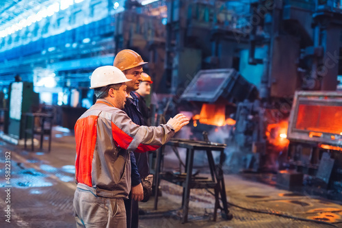 Workers in the steel mill.