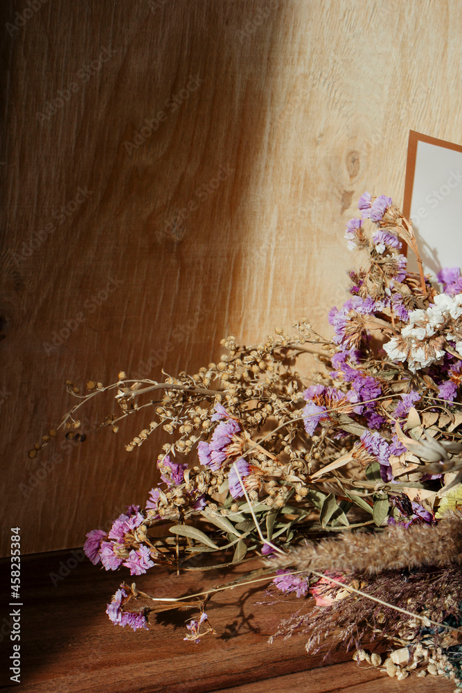 Beautiful bouquet of various dried flowers in the sun close up